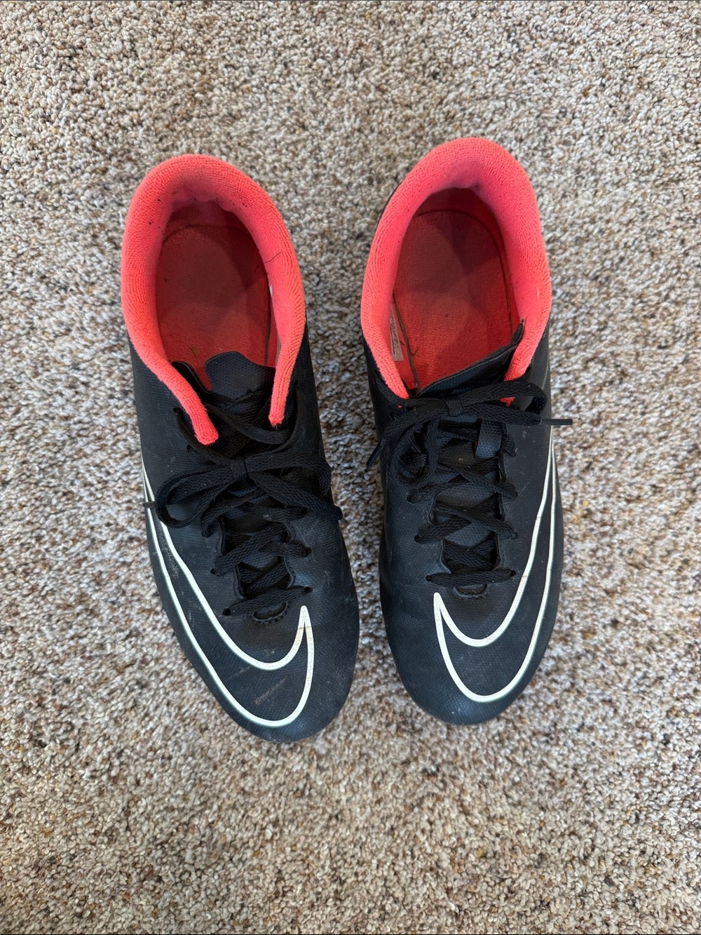 Nike Black Soccer Cleats with White Swoosh and Hot Pink lining